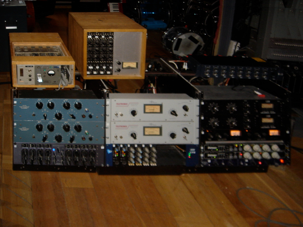 A rack of outboard studio compressors, limiters and equalisers.